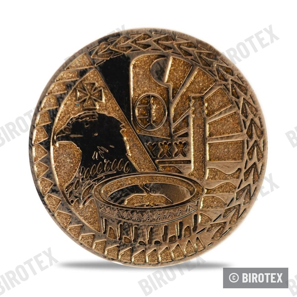 Moneda de bronce, águila y arenas